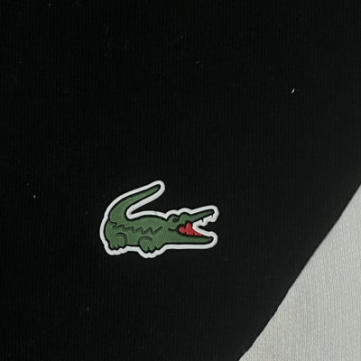 turquoise Lacoste trackjacket {S}