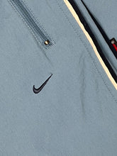 Lade das Bild in den Galerie-Viewer, vintage babyblue Nike trackpants {XL}
