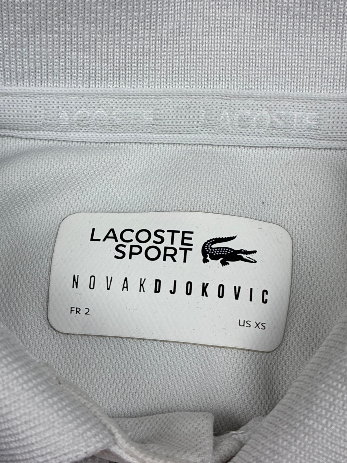 white Lacoste polo {S}
