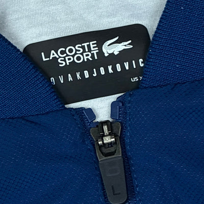 navyblue Lacoste windbreaker {S}