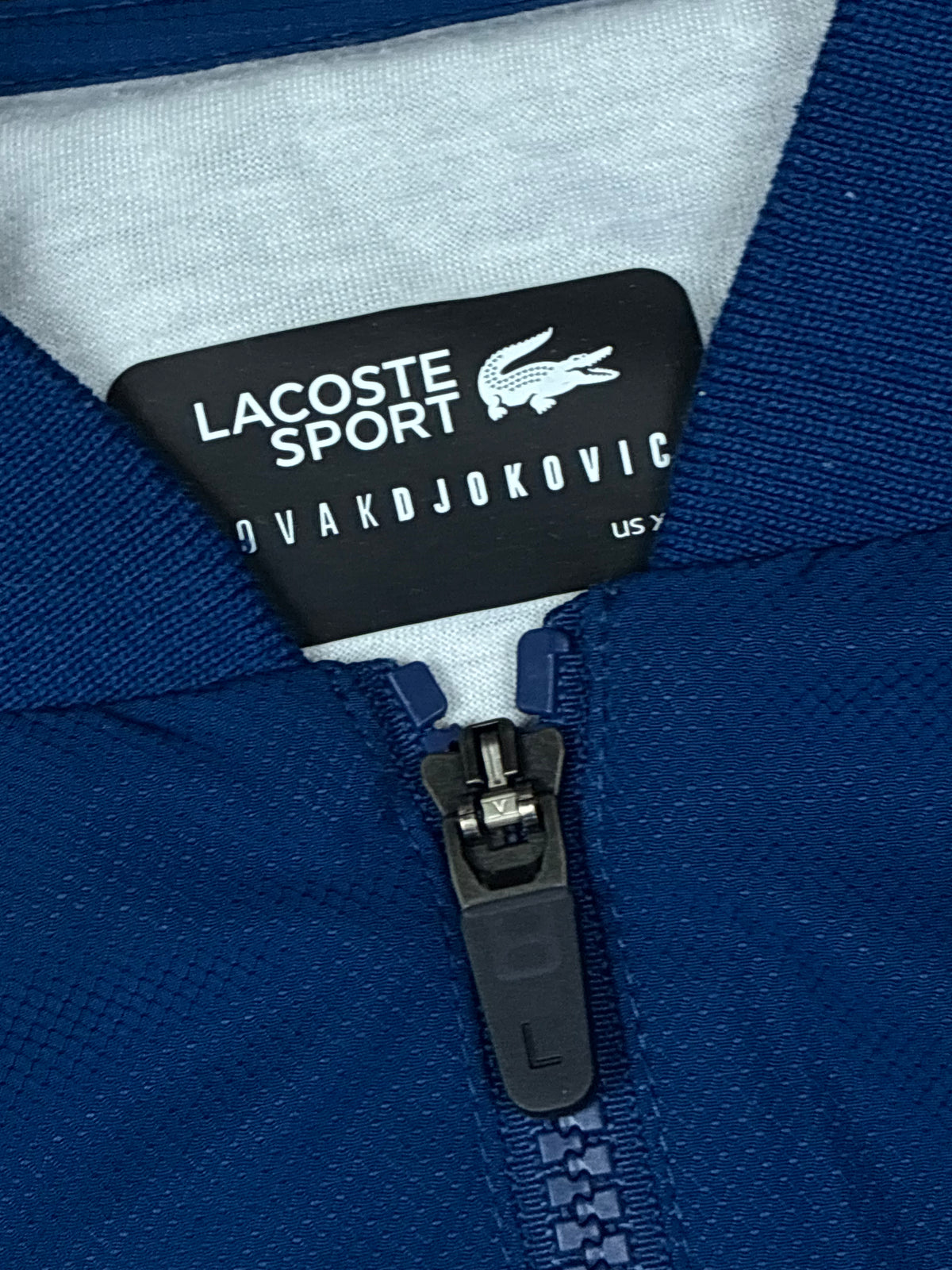 navyblue Lacoste windbreaker {S}