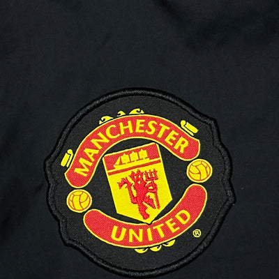 vintage Nike Manchester United trackpants {S}