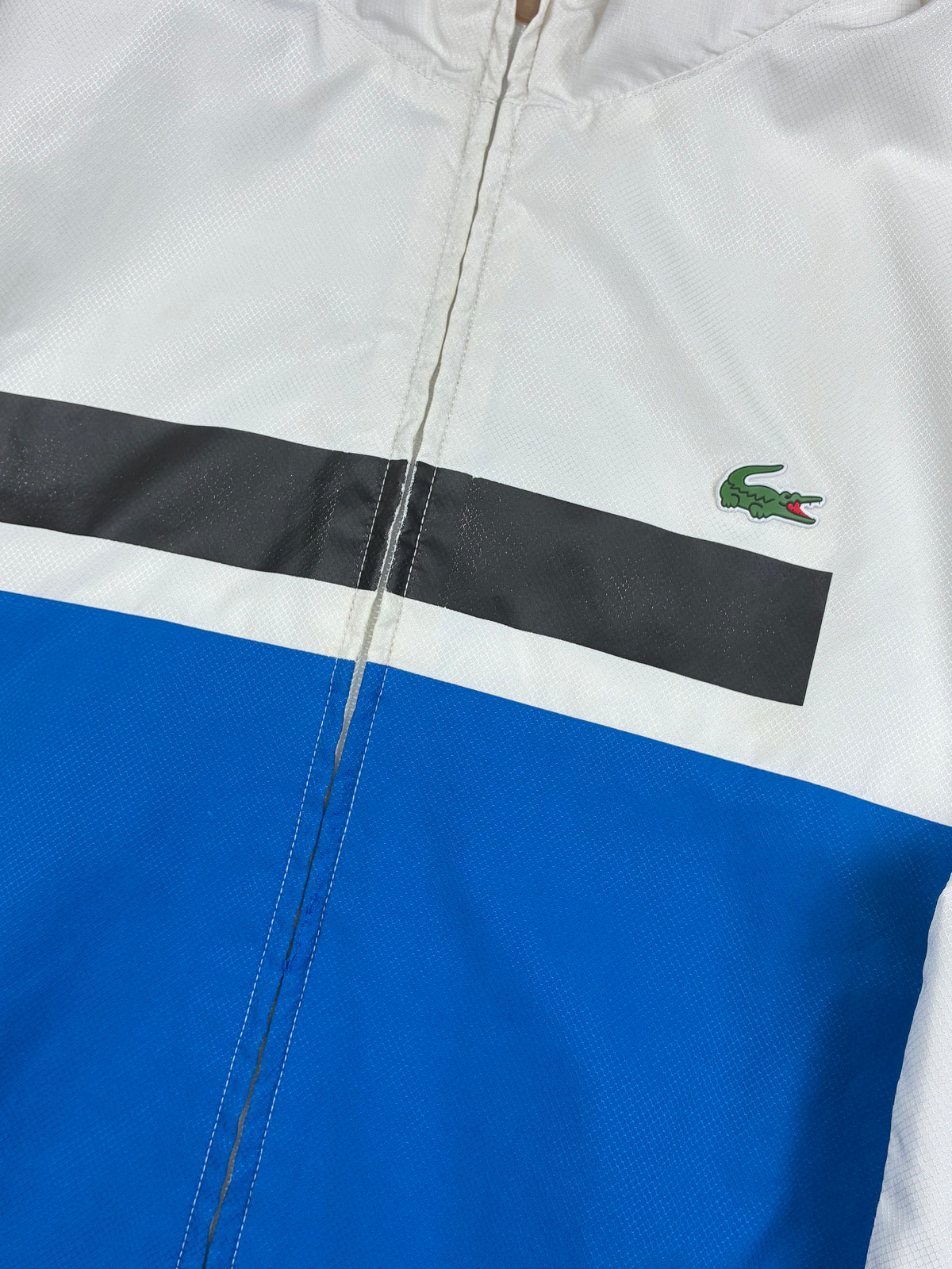 blue Lacoste windbreaker {S}