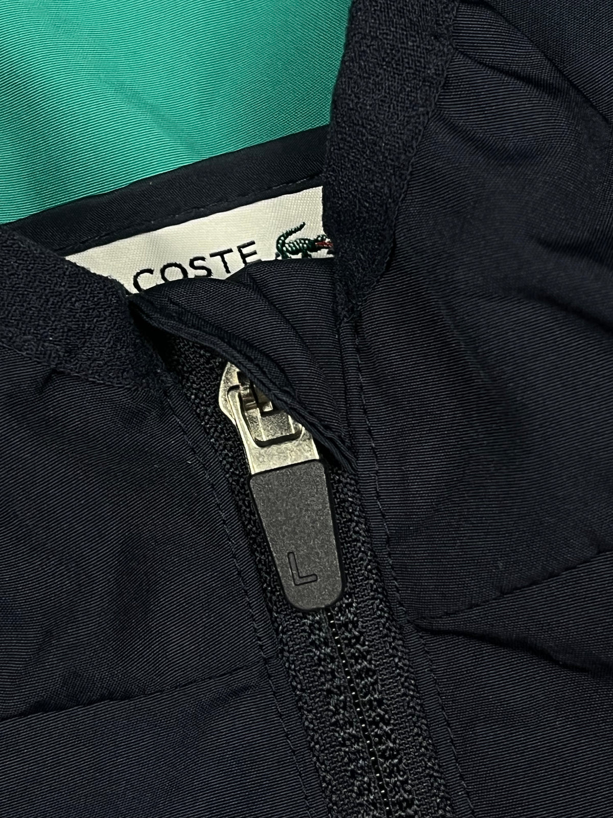 turquoise Lacoste windbreaker {XS}