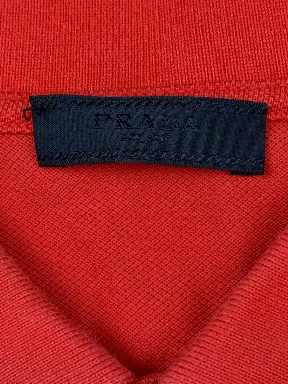 orange Prada polo {M}