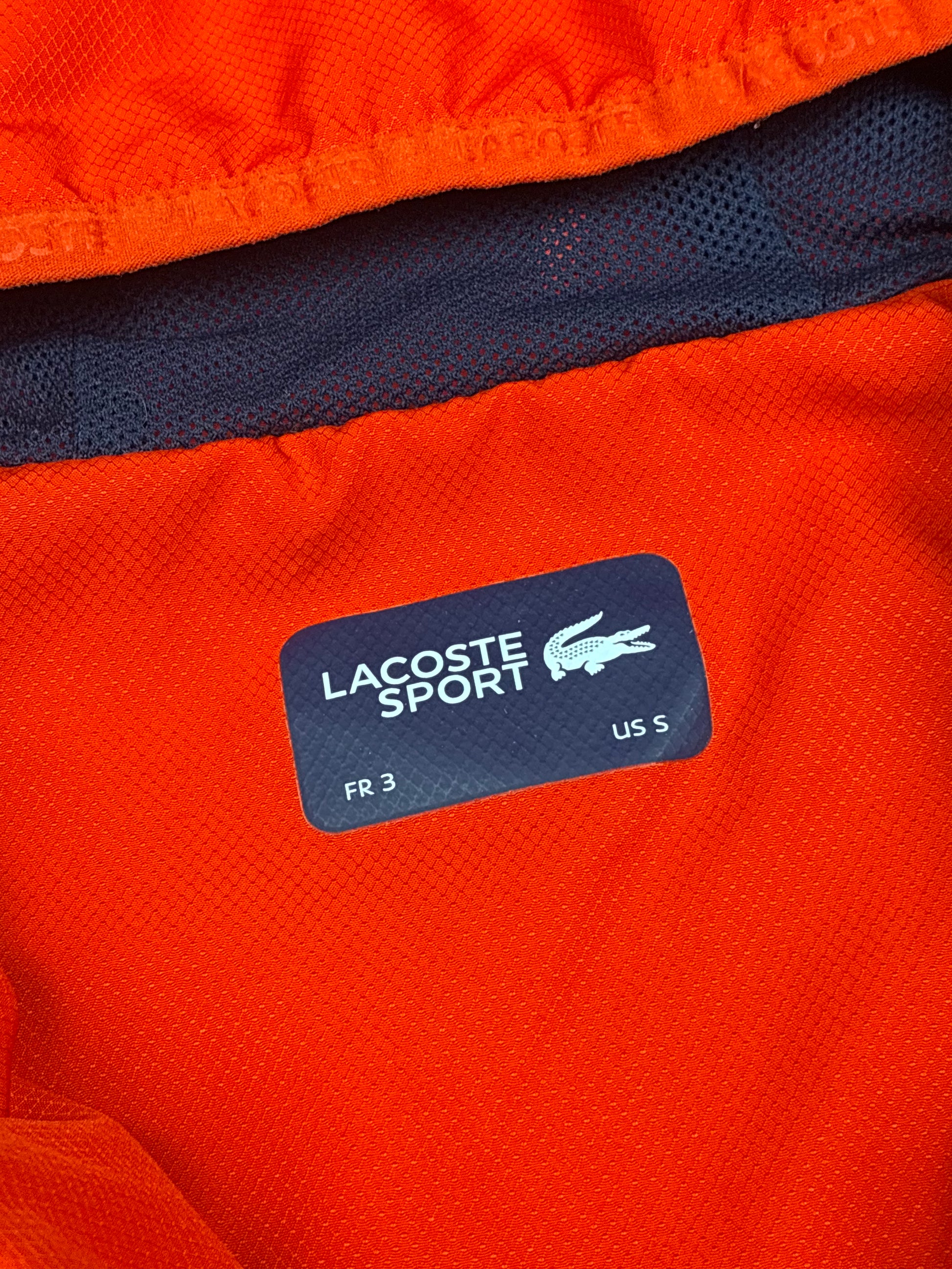 orange Lacoste windbreaker {S}