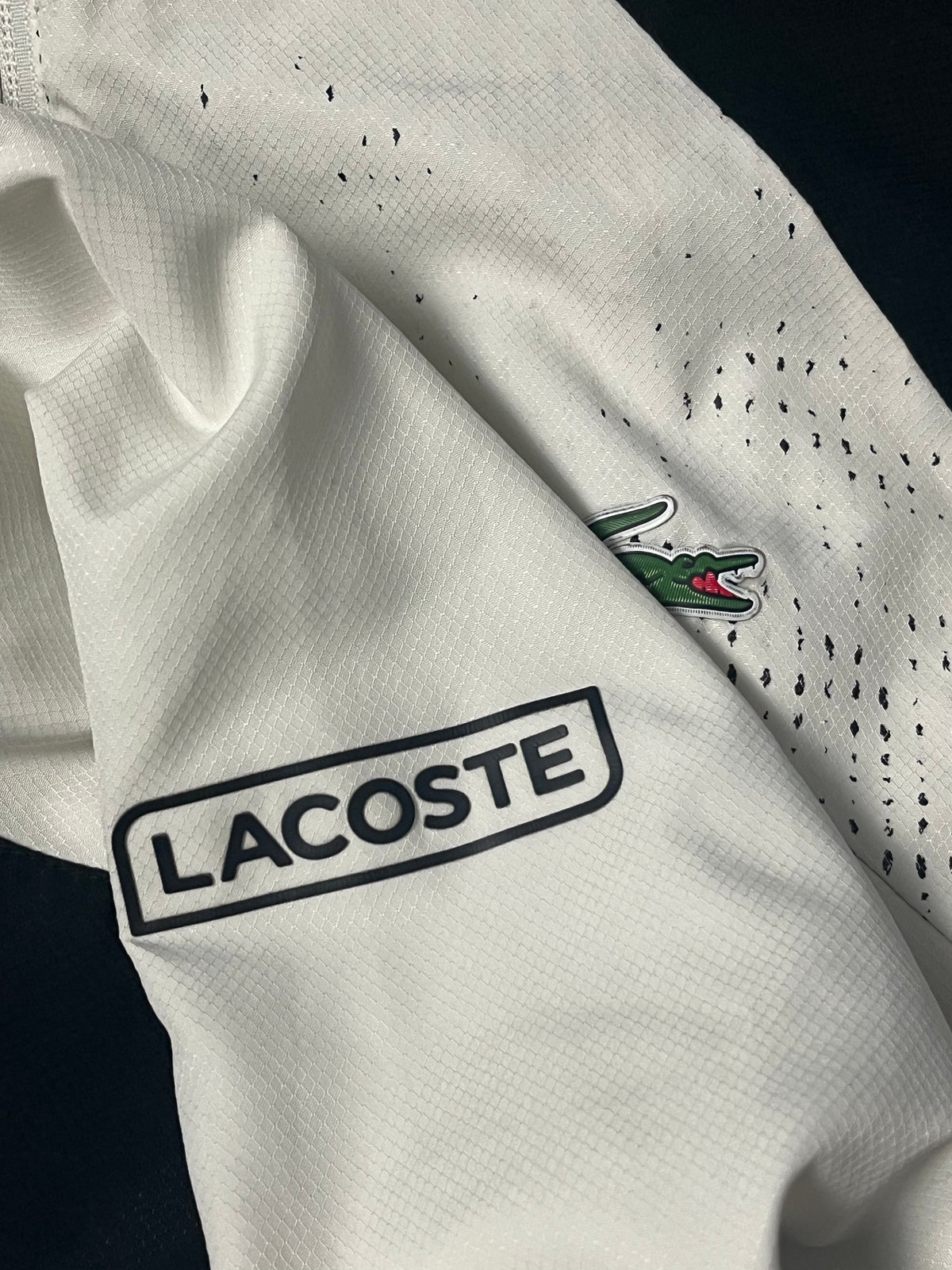 white Lacoste windbreaker {S}