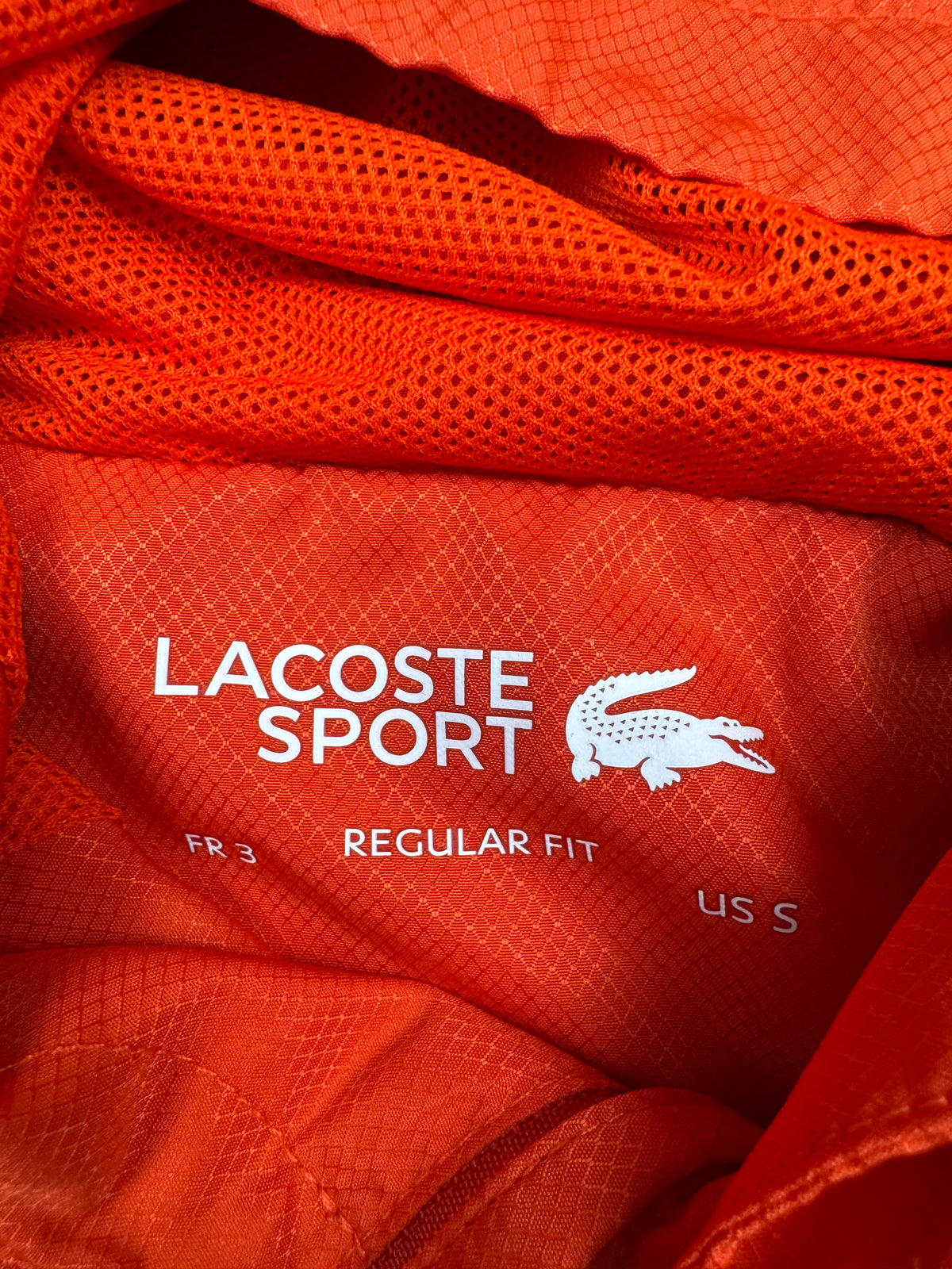 orange Lacoste windbreaker {S}