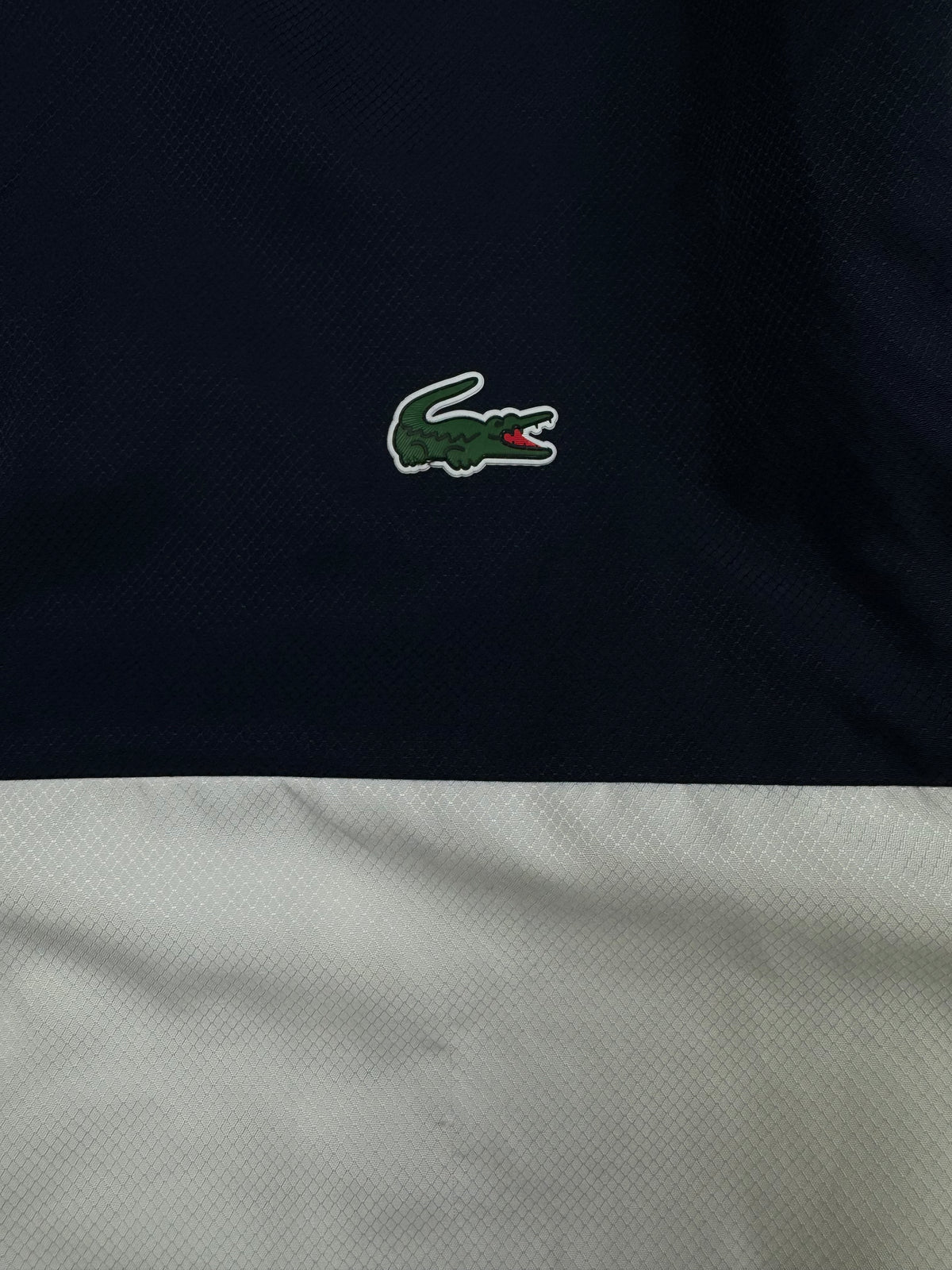 white Lacoste windbreaker {S}