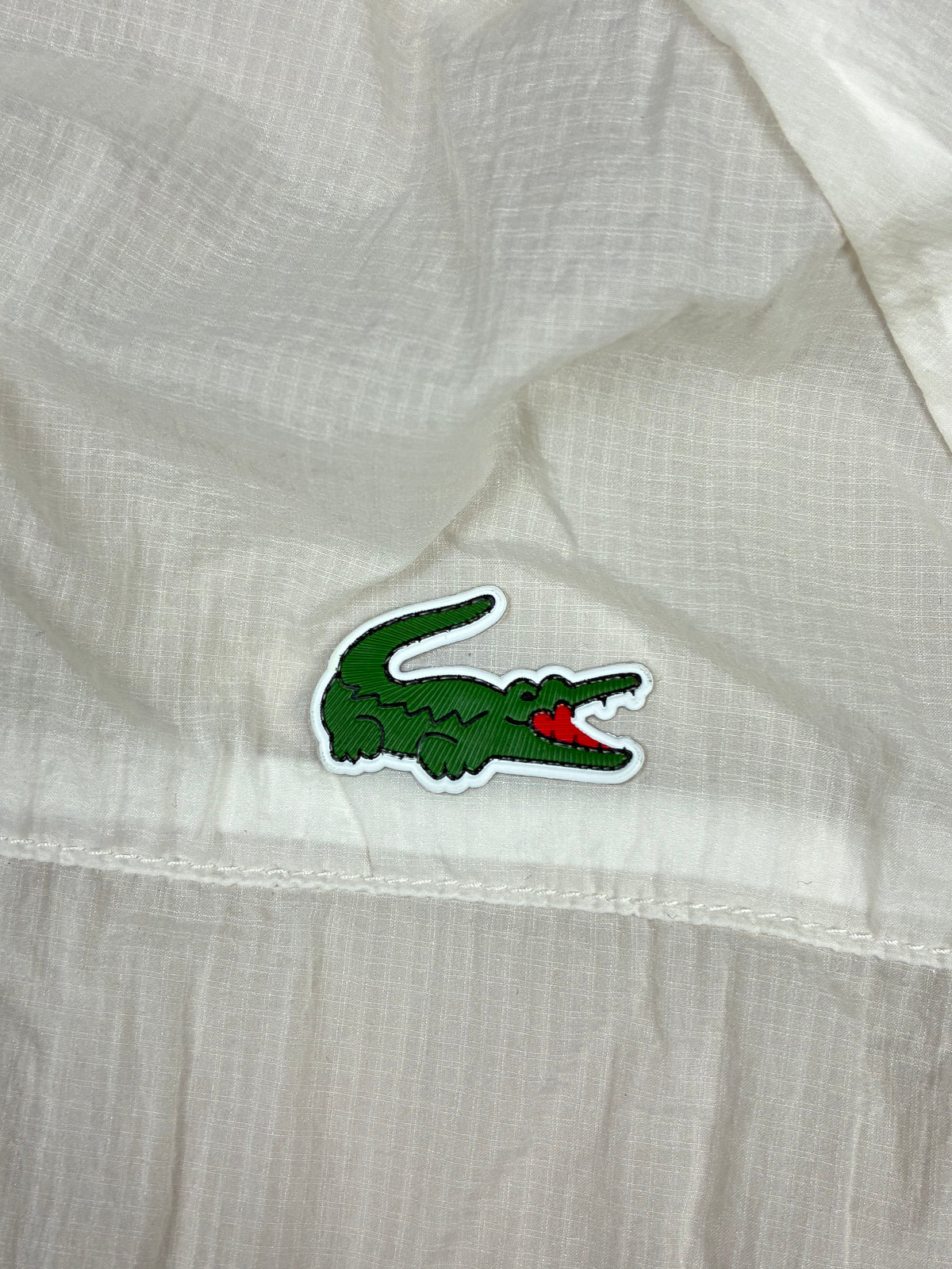 white Lacoste windbreaker {L}