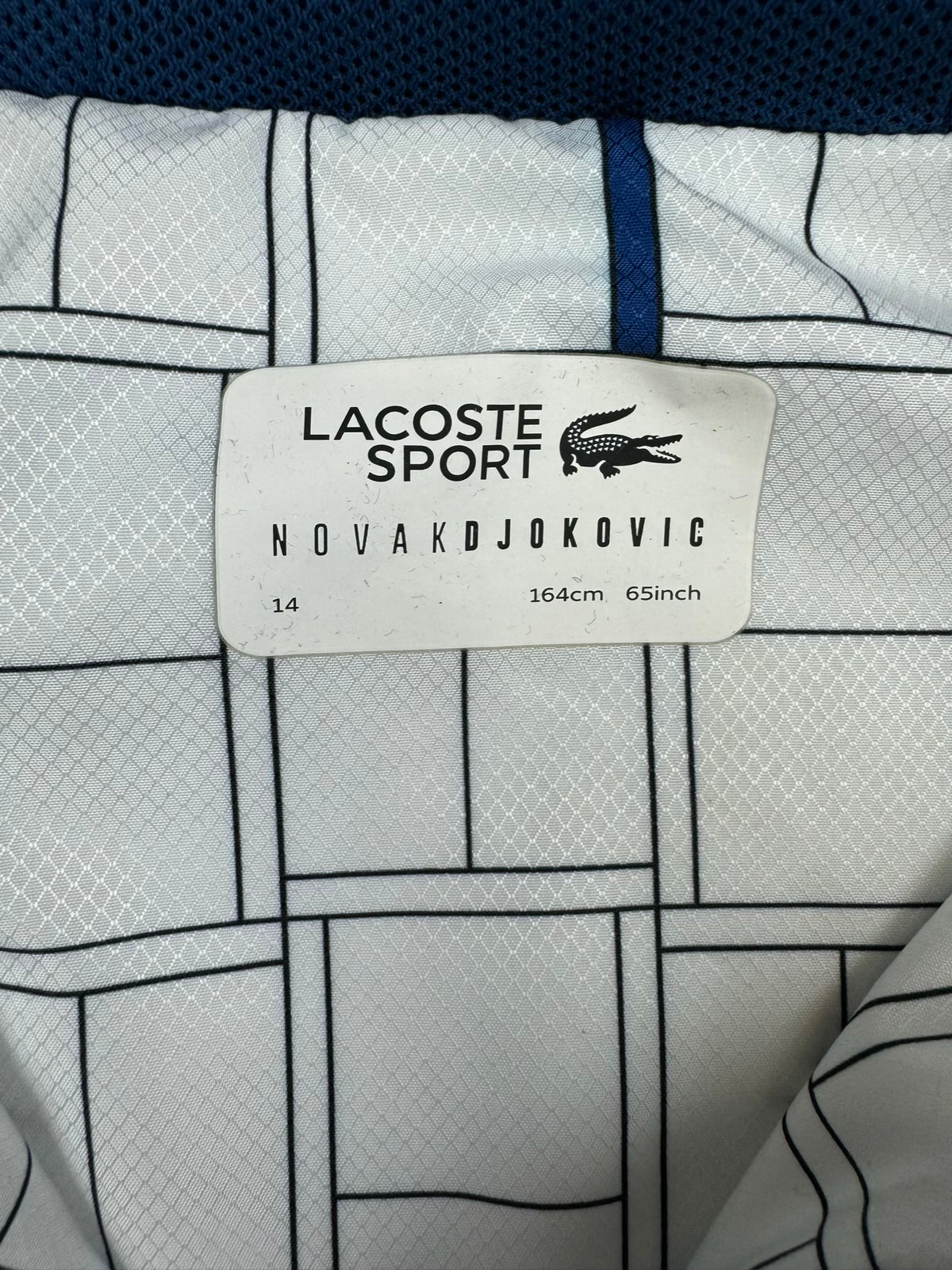 white Lacoste windbreaker {XS}