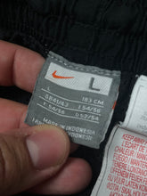 Load image into Gallery viewer, vintage Nike trackpants {L}
