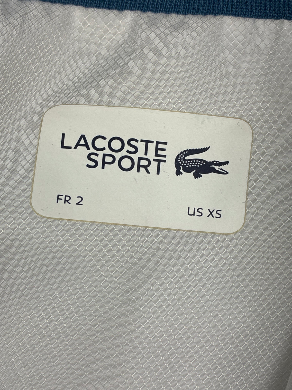 white Lacoste windbreaker {S}