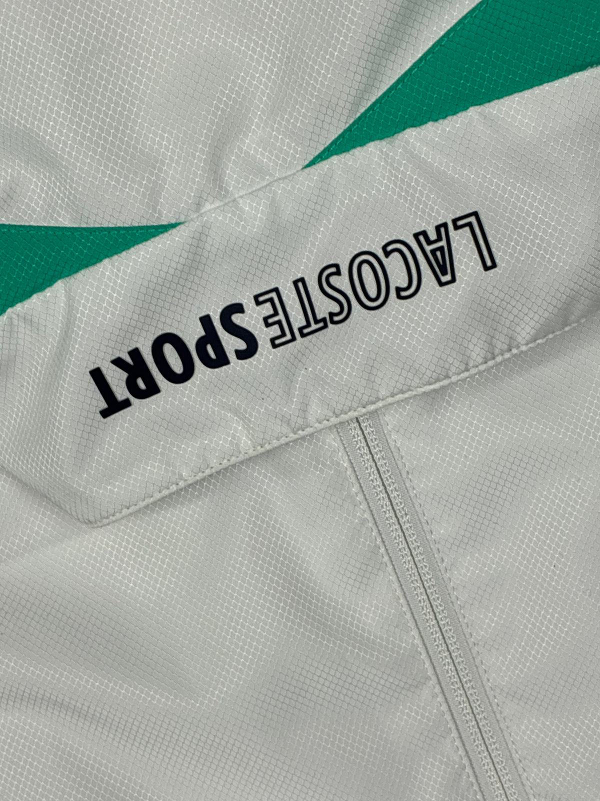 white Lacoste windbreaker {S}