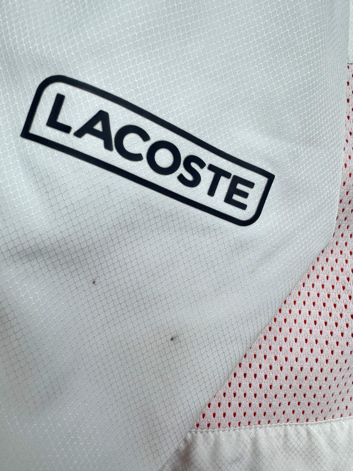 white Lacoste windbreaker {S}