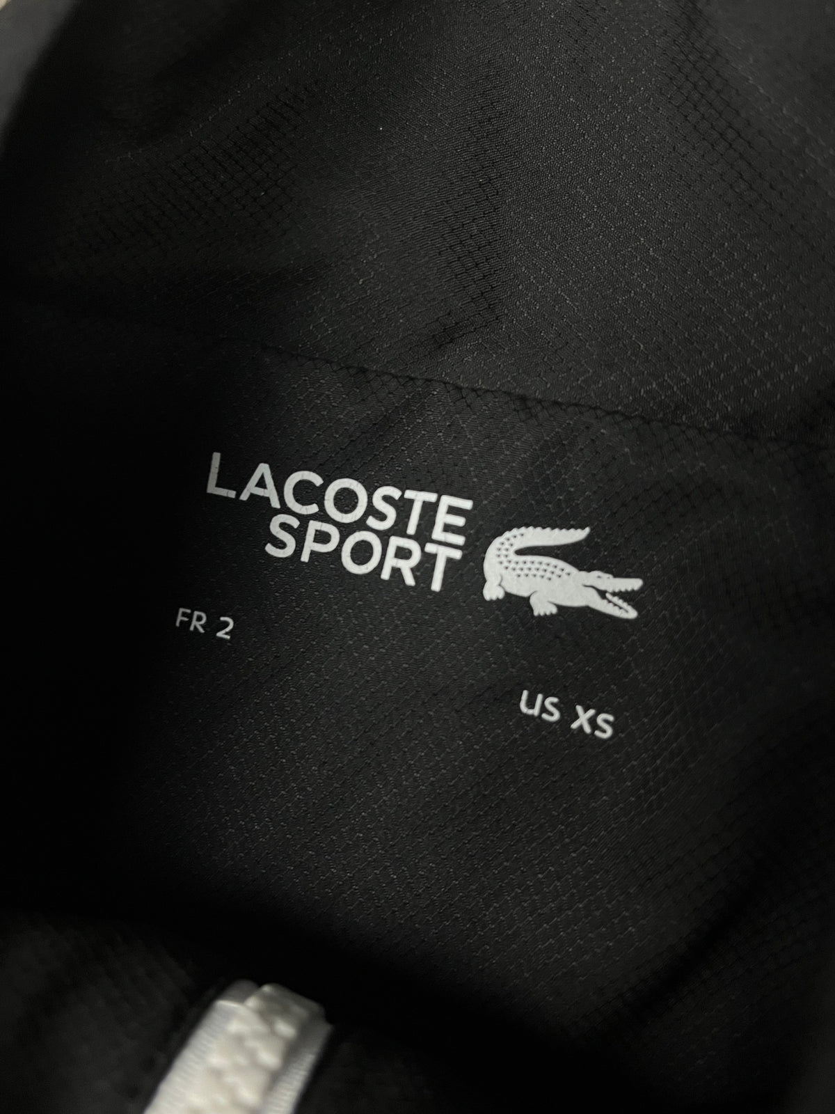 black/white Lacoste windbreaker {XS}