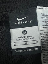 Load image into Gallery viewer, vintage Nike trackpants {M}
