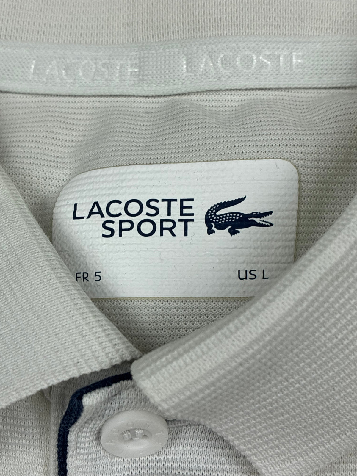 white Lacoste polo {M}