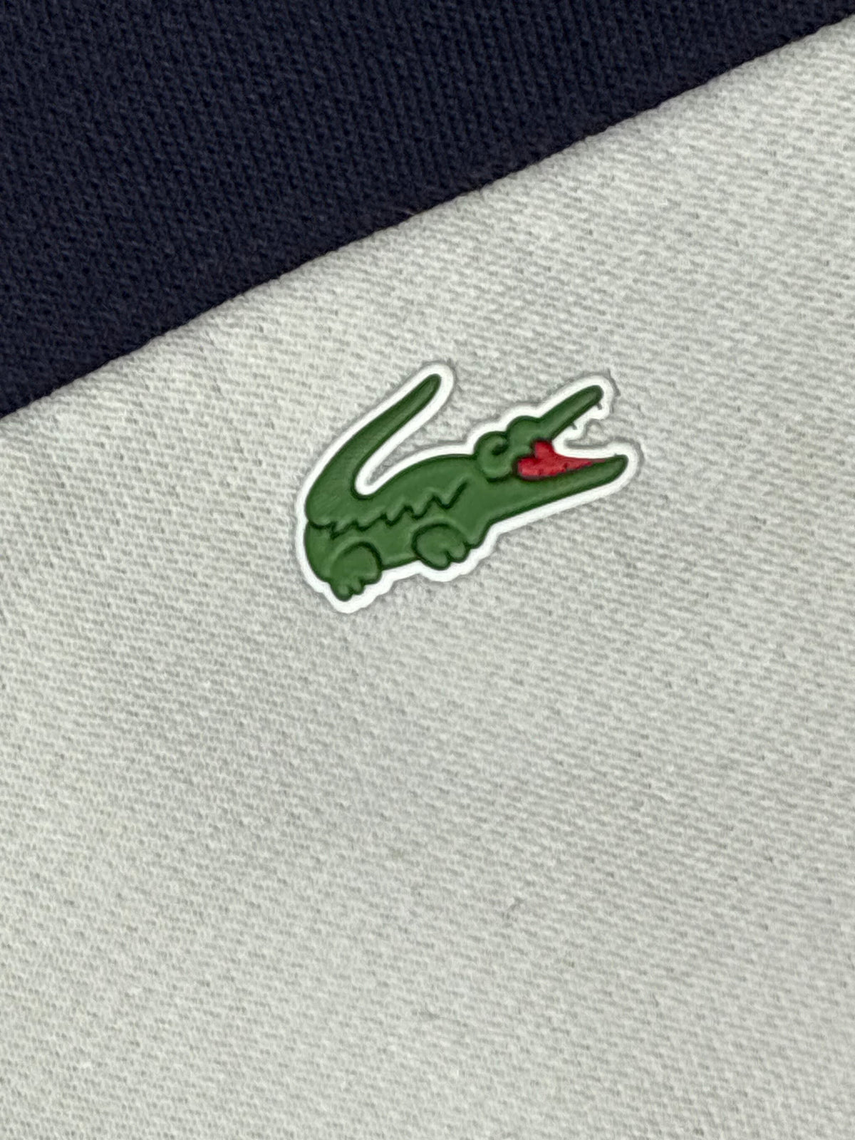 white Lacoste trackjacket {XS}