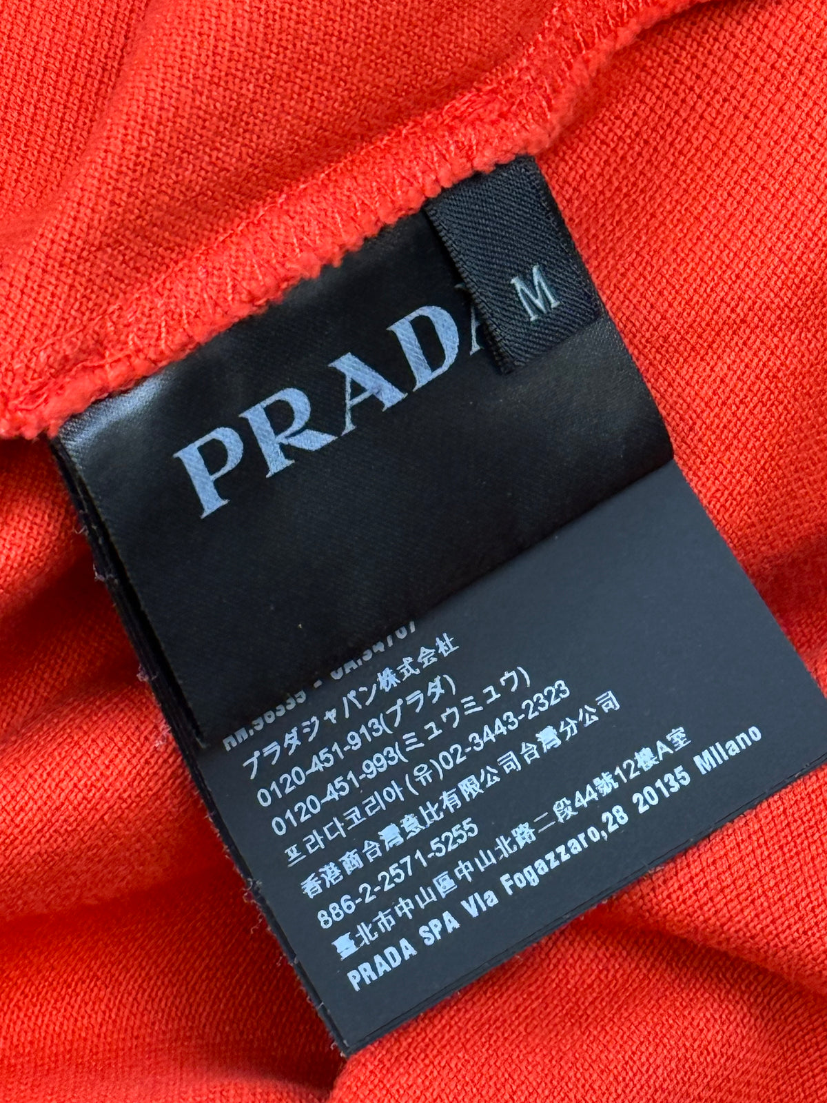 orange Prada polo {M}