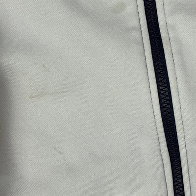 white Lacoste trackjacket {XS}