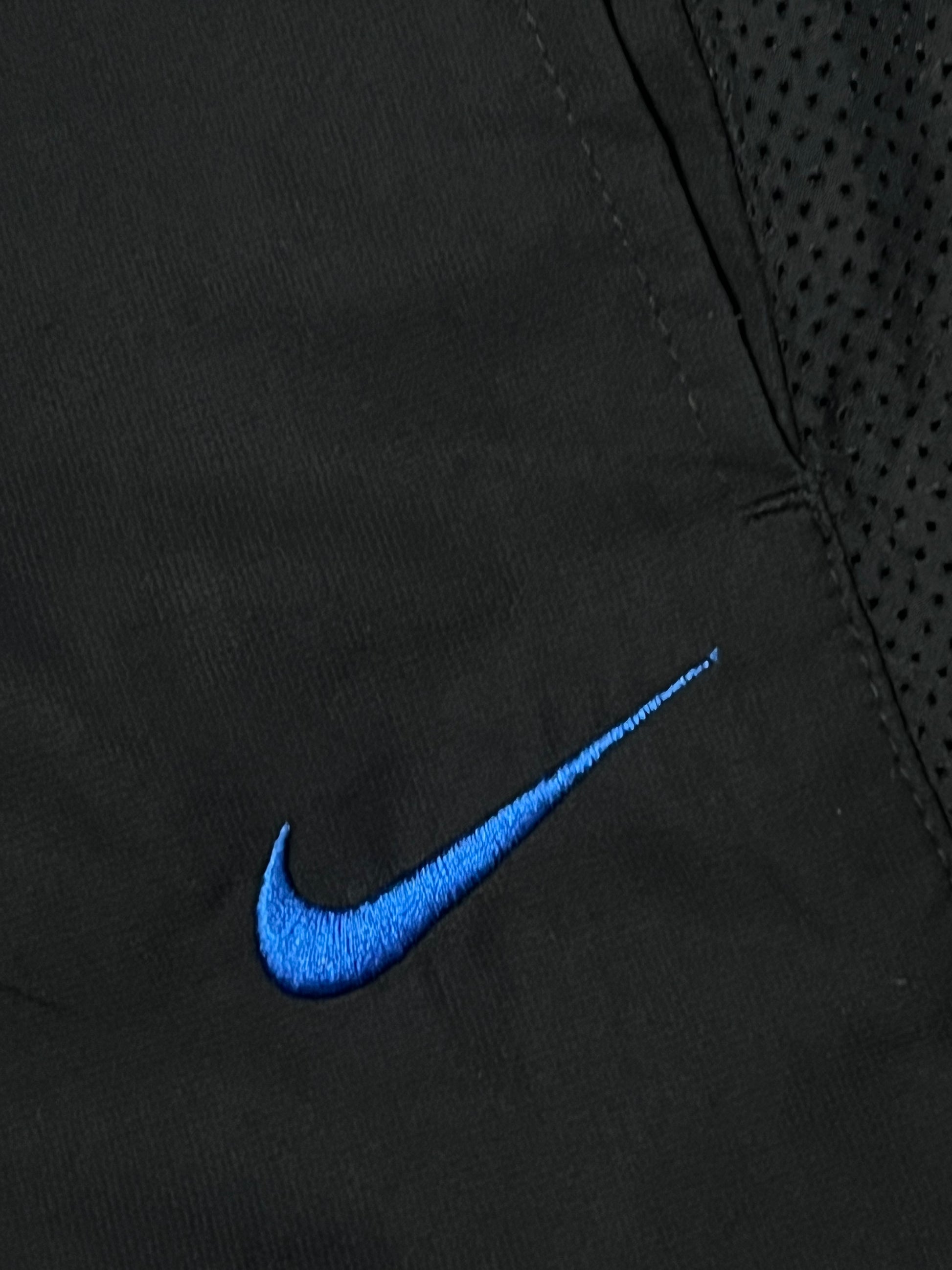 vintage Nike trackpants {L}