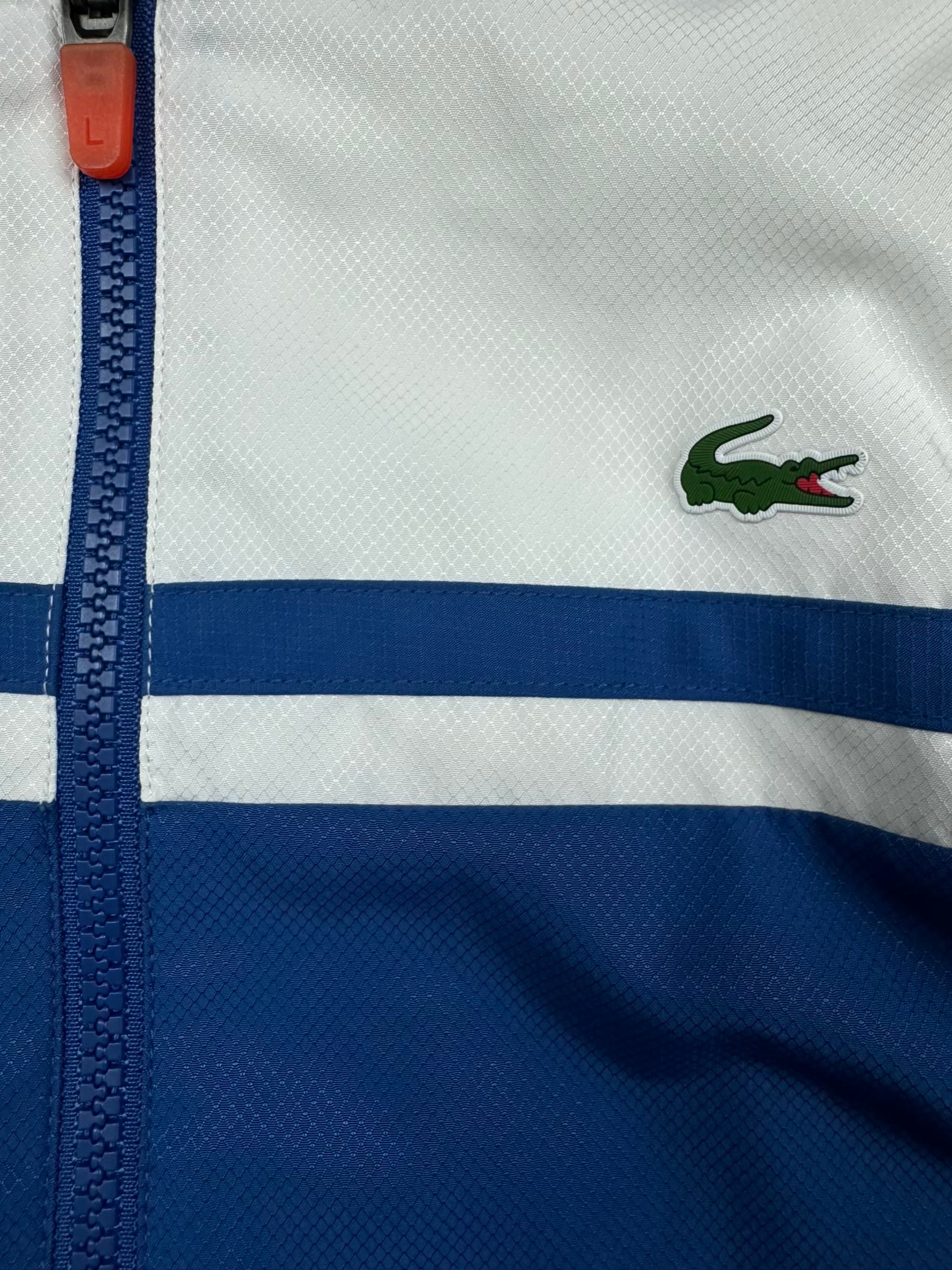 blue Lacoste windbreaker {XS}
