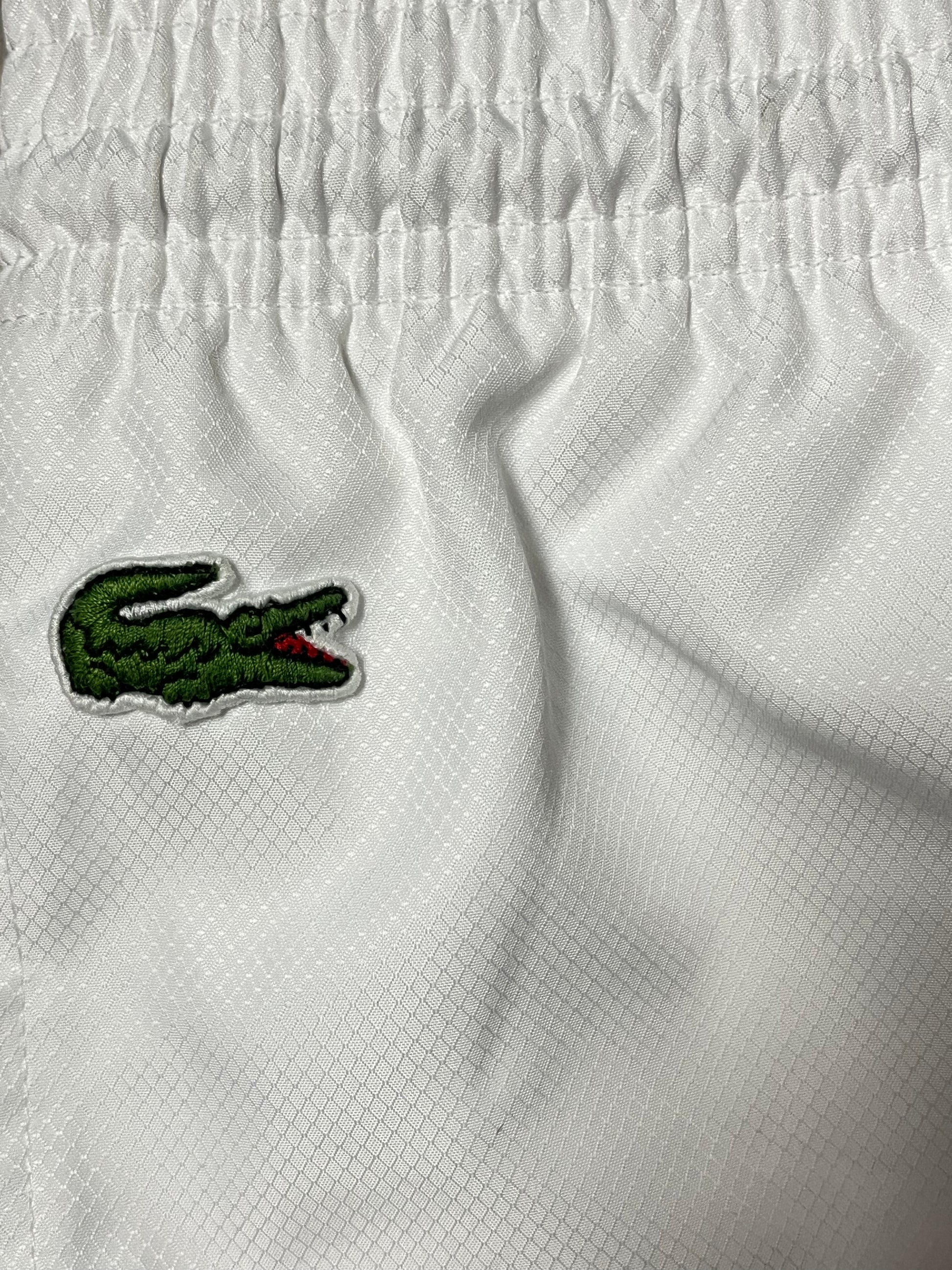 white Lacoste trackpants {M}