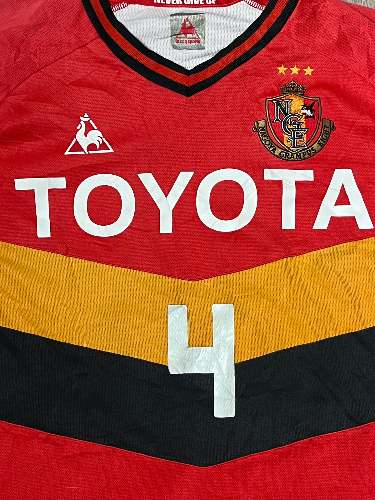 vintage Le Coq Sportif Nagoya Grampus TULIO4 2011-2012 home jersey {S}