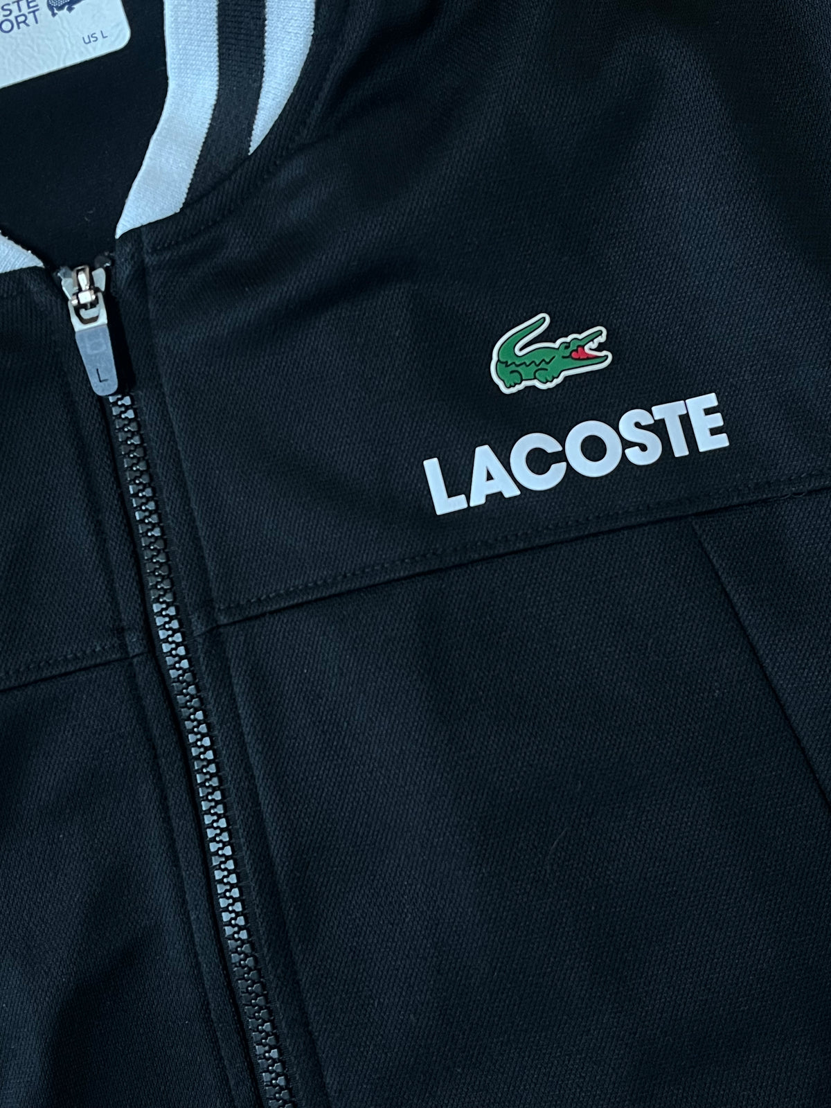 black Lacoste trackjacket {L}