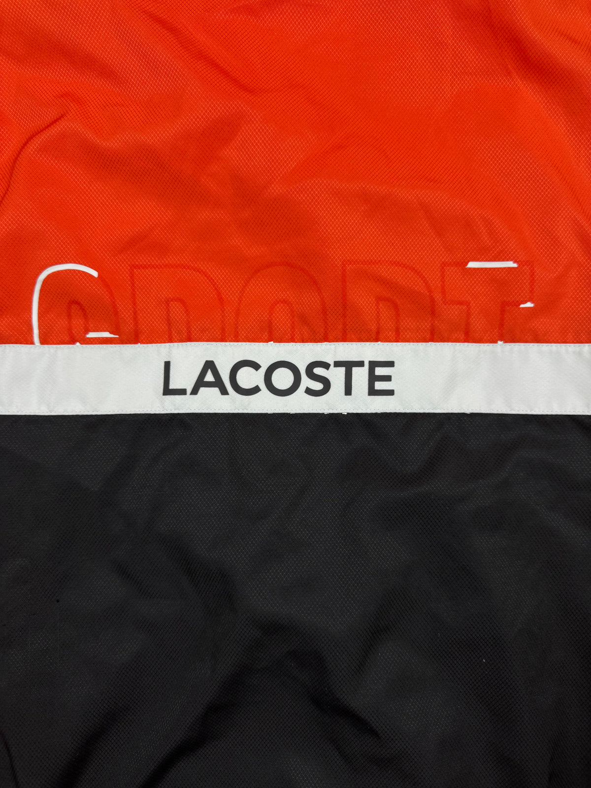 orange Lacoste windbreaker {S}
