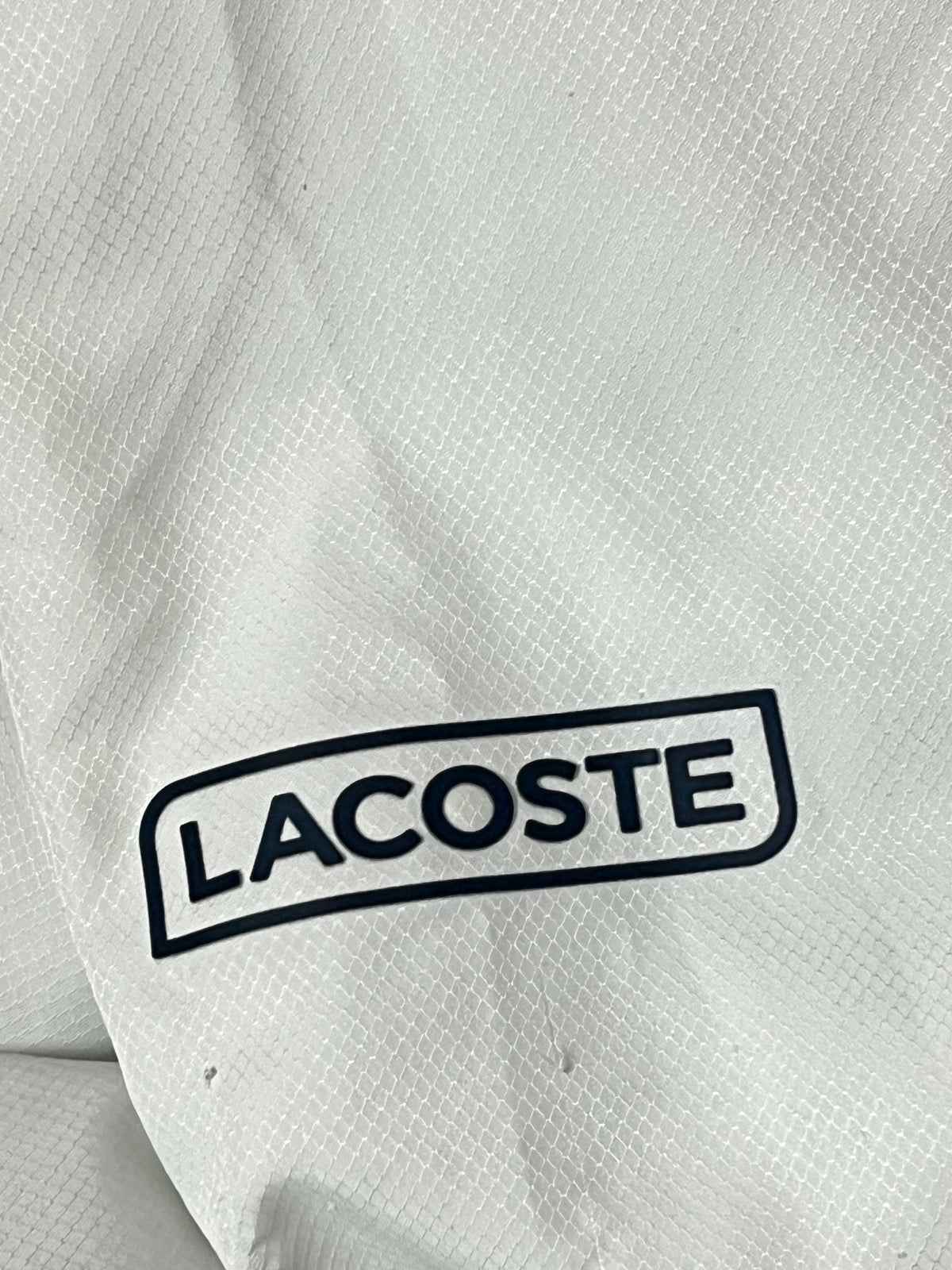 white Lacoste windbreaker {XXL}