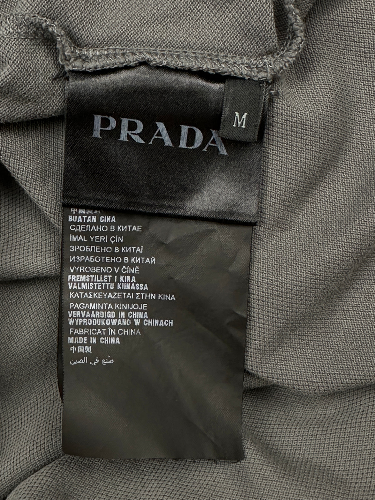 grey Prada polo {M}