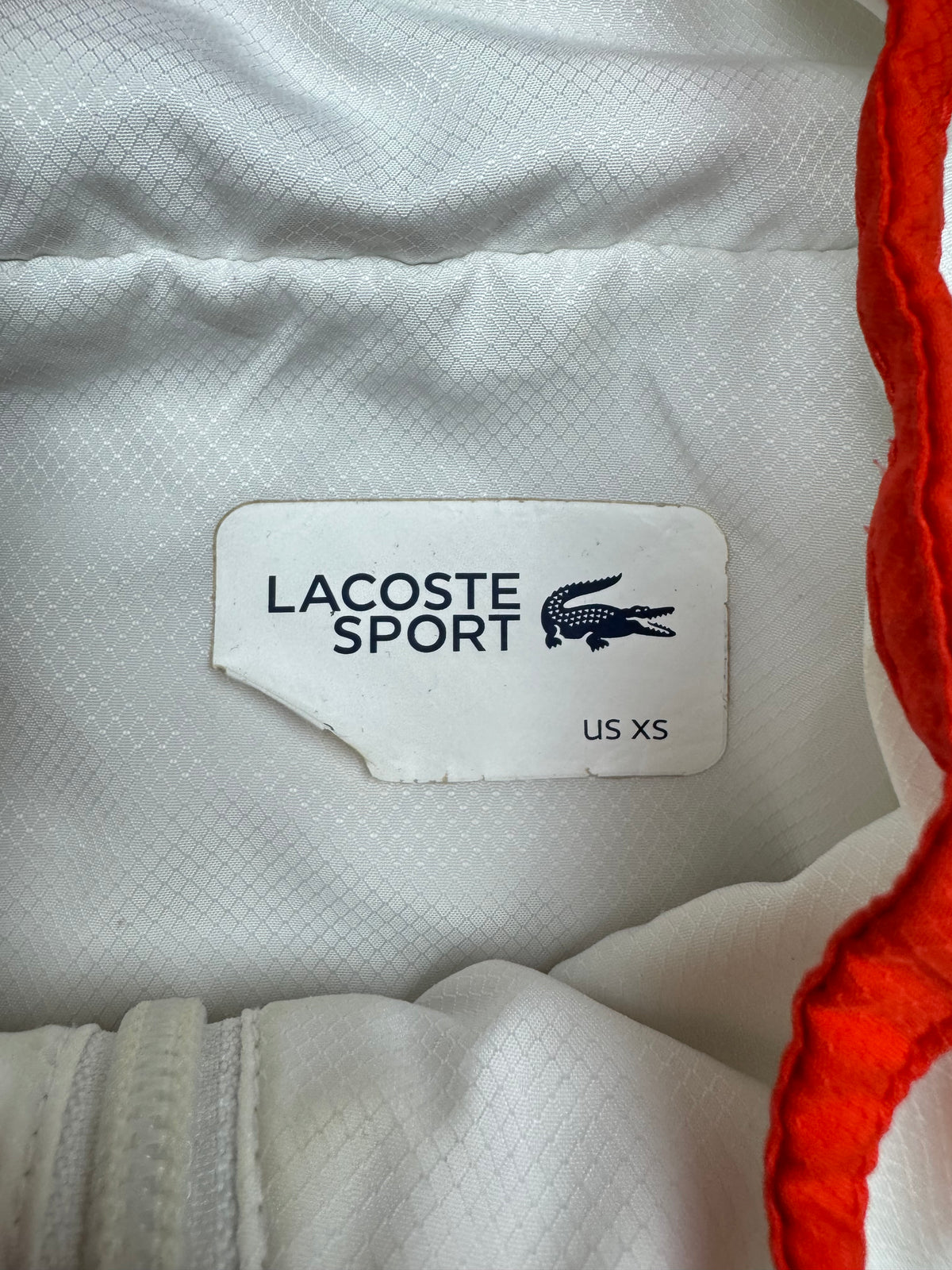 white Lacoste windbreaker {S}