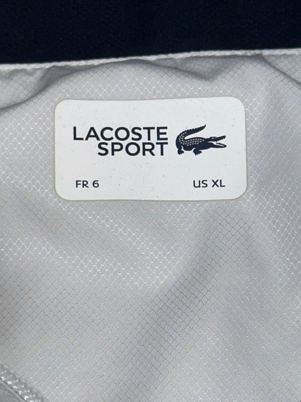 white Lacoste windbreaker {XL}
