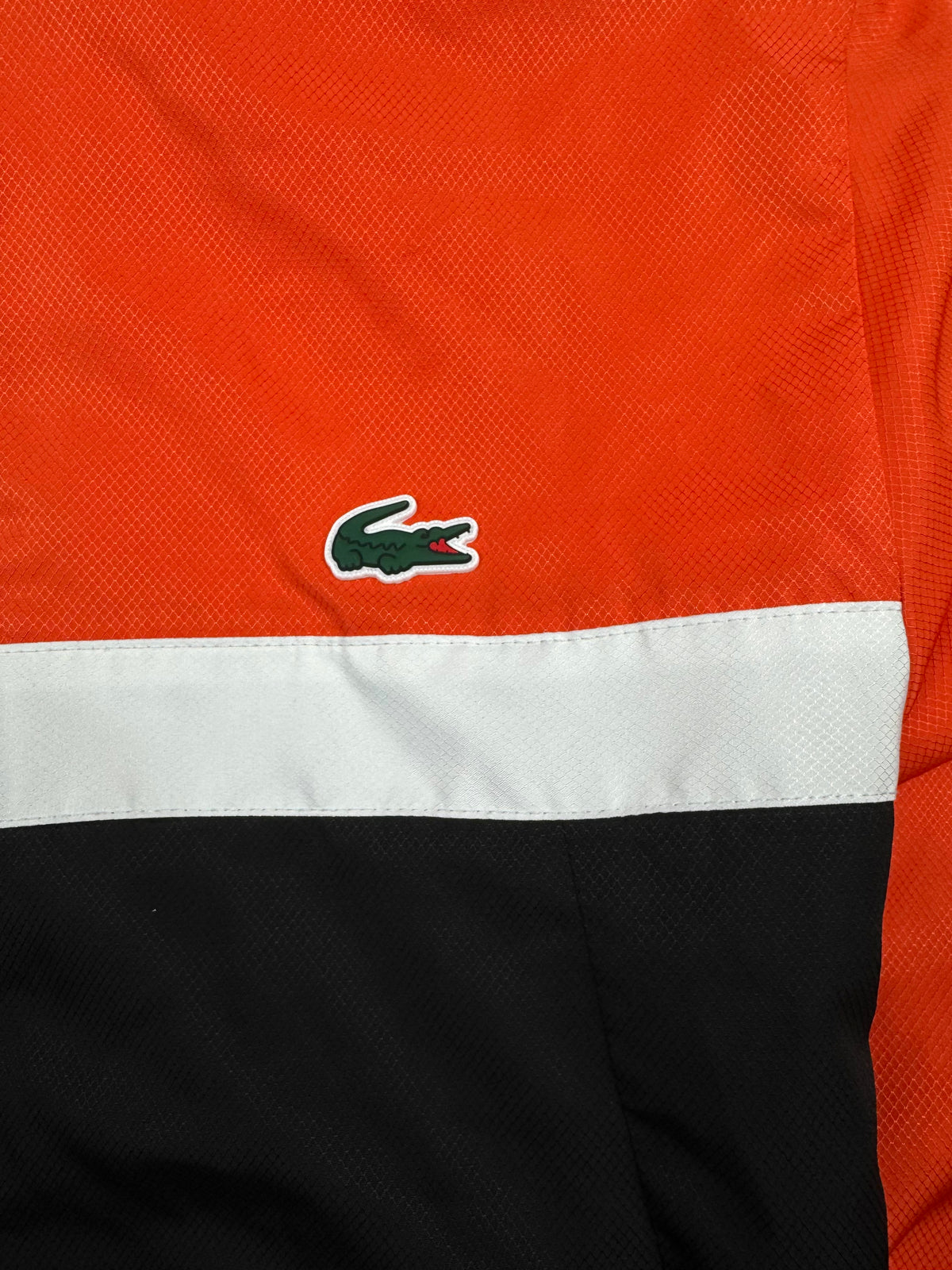 orange Lacoste windbreaker {S}