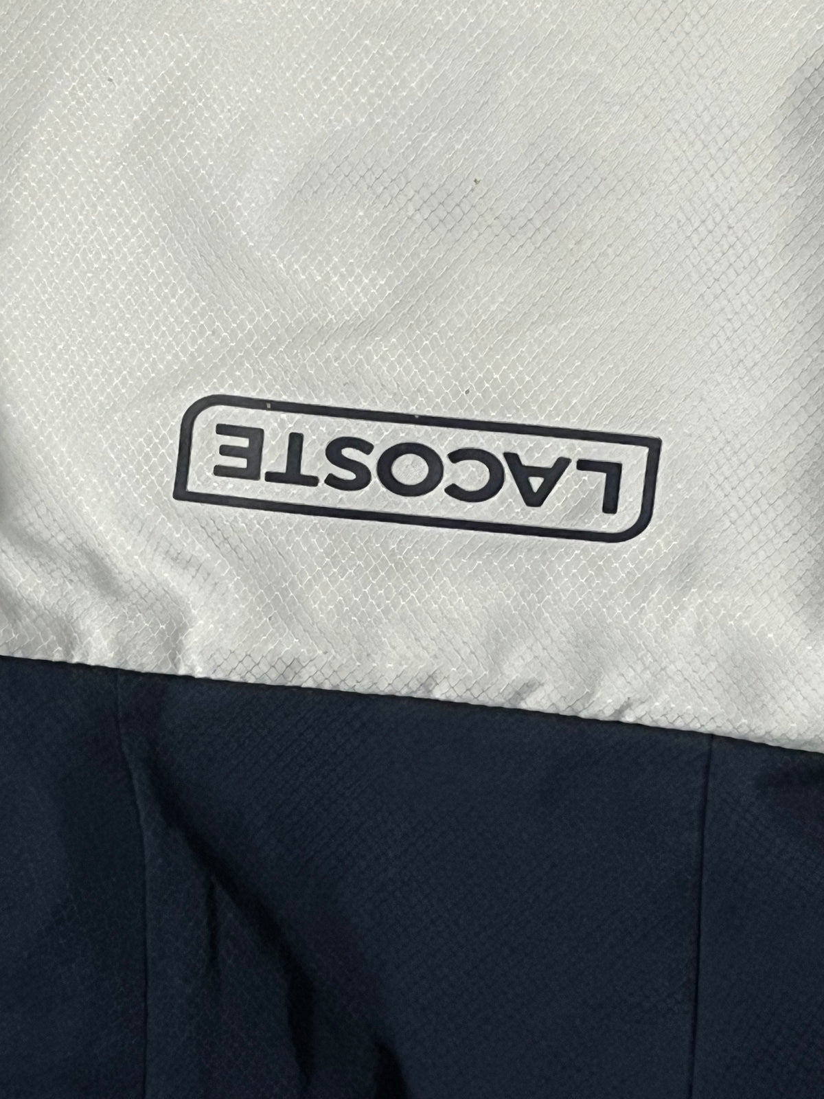 white Lacoste windbreaker {M}