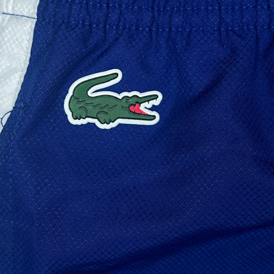 blue Lacoste trackpants {S}