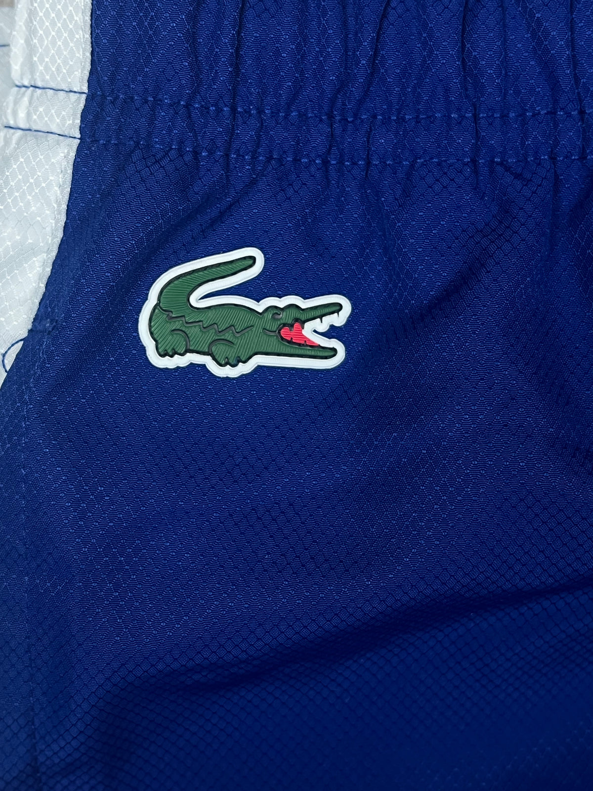 blue Lacoste trackpants {S}