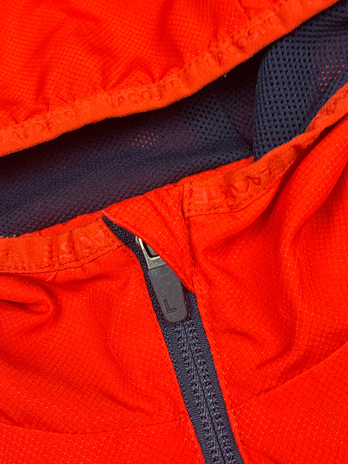 orange Lacoste windbreaker {S}