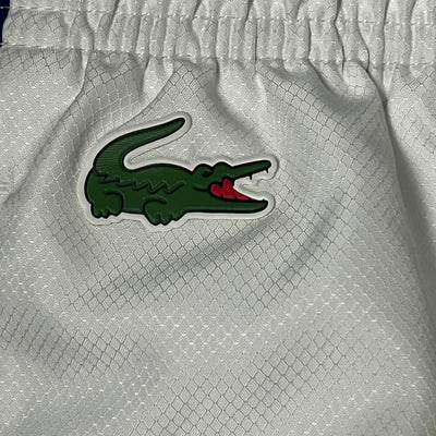 white Lacoste trackpants {XL}