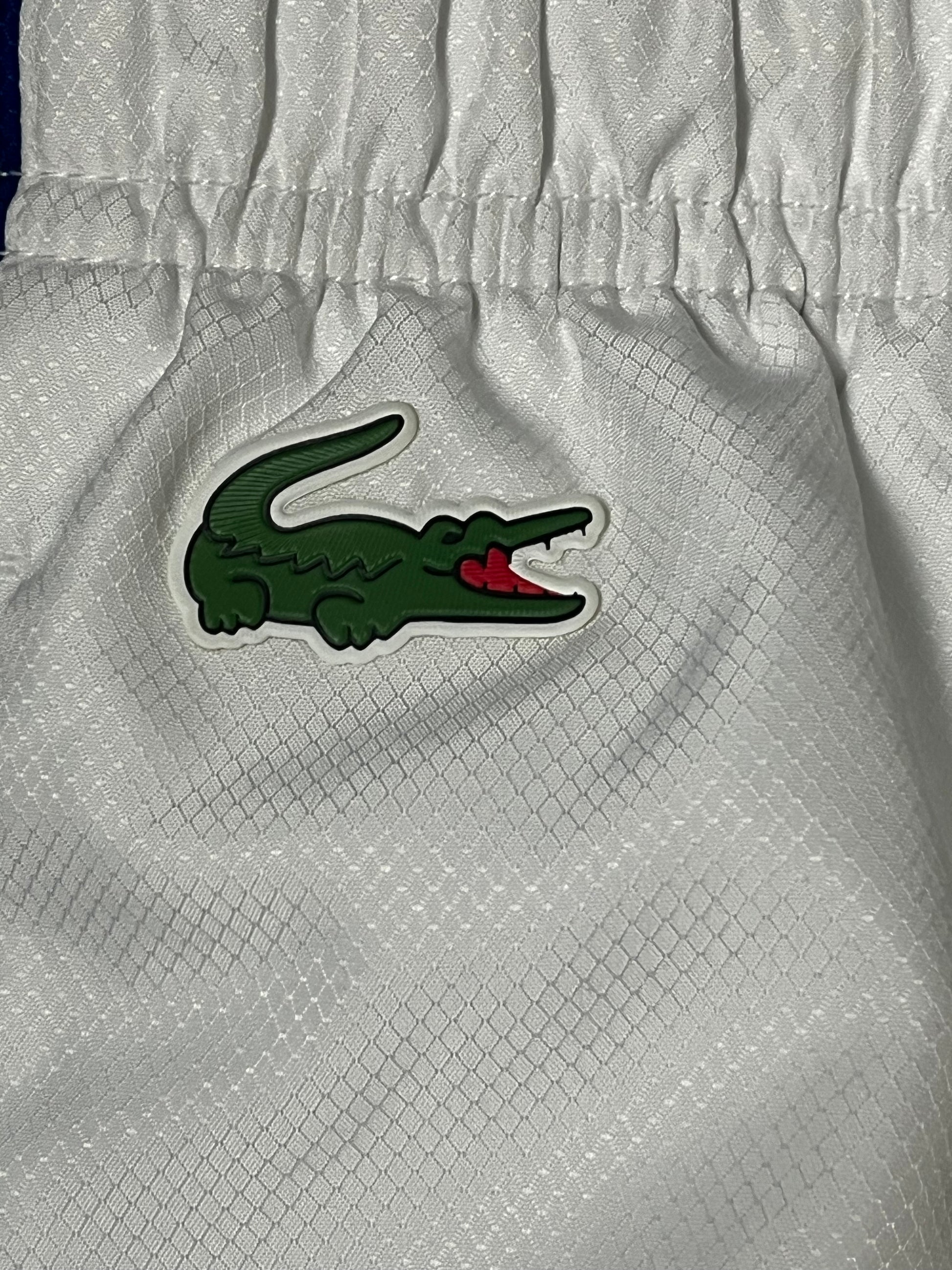 white Lacoste trackpants {XL}