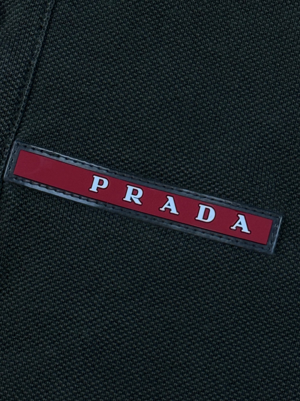 khaki Prada polo {M}
