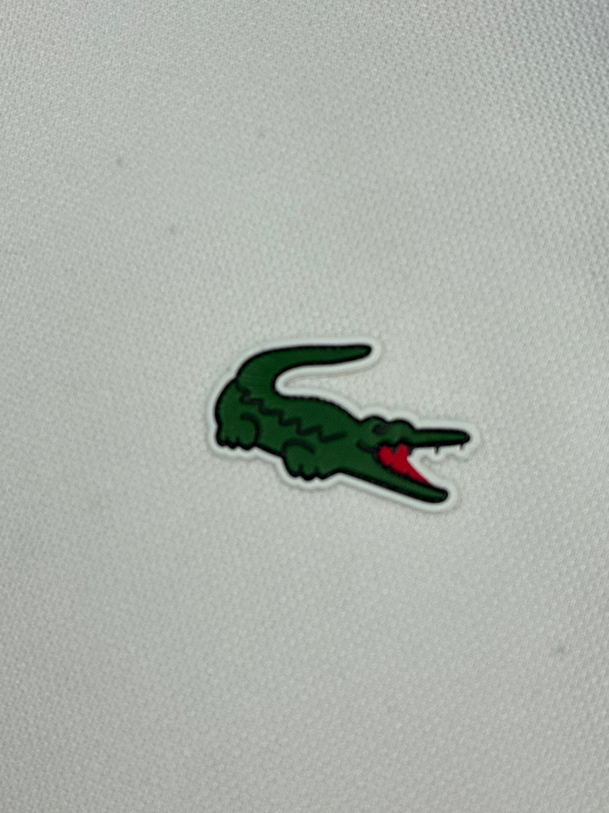 white Lacoste polo {XS}