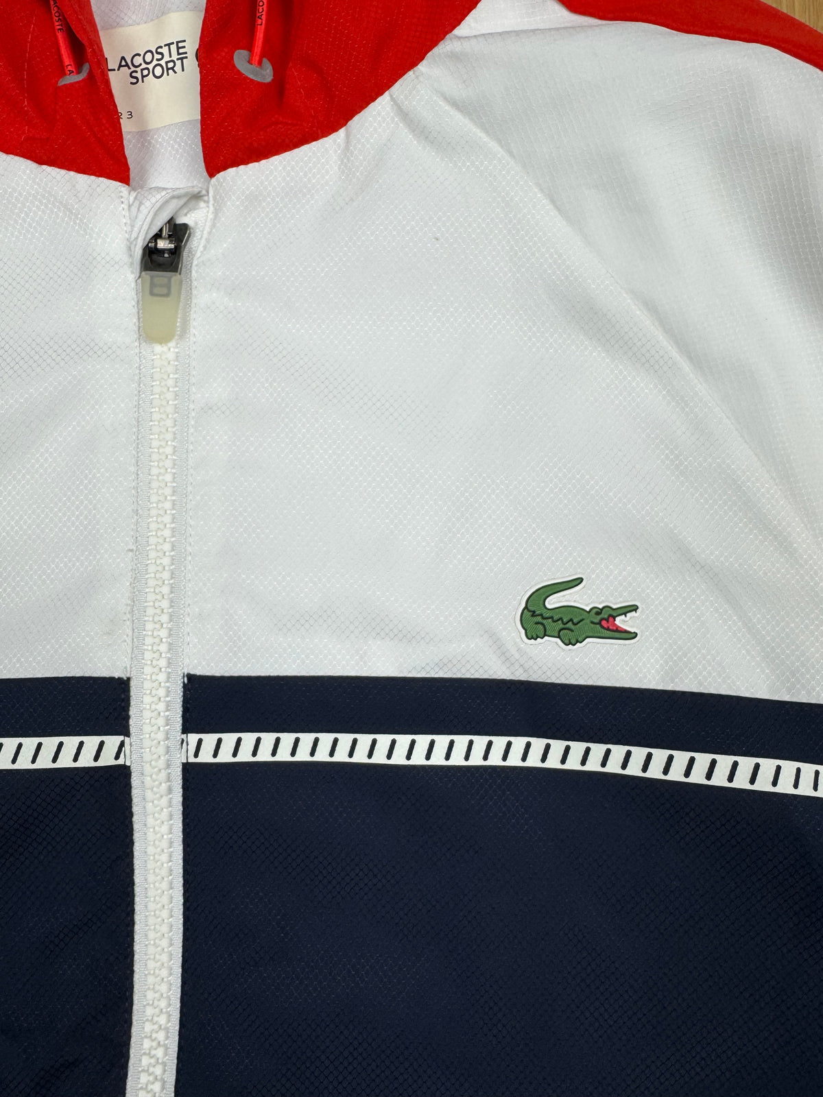 white Lacoste windbreaker {S}