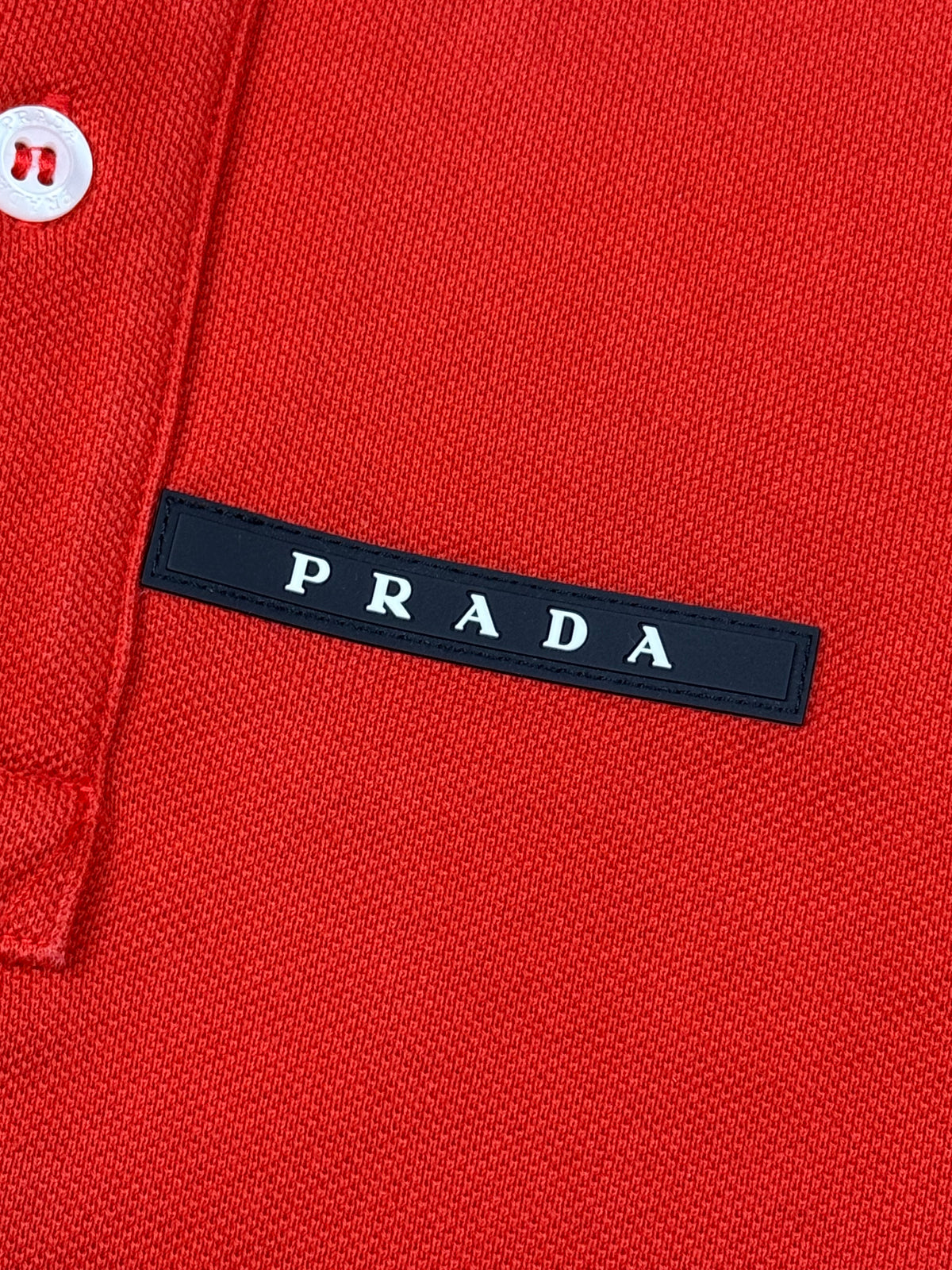orange Prada polo {M}