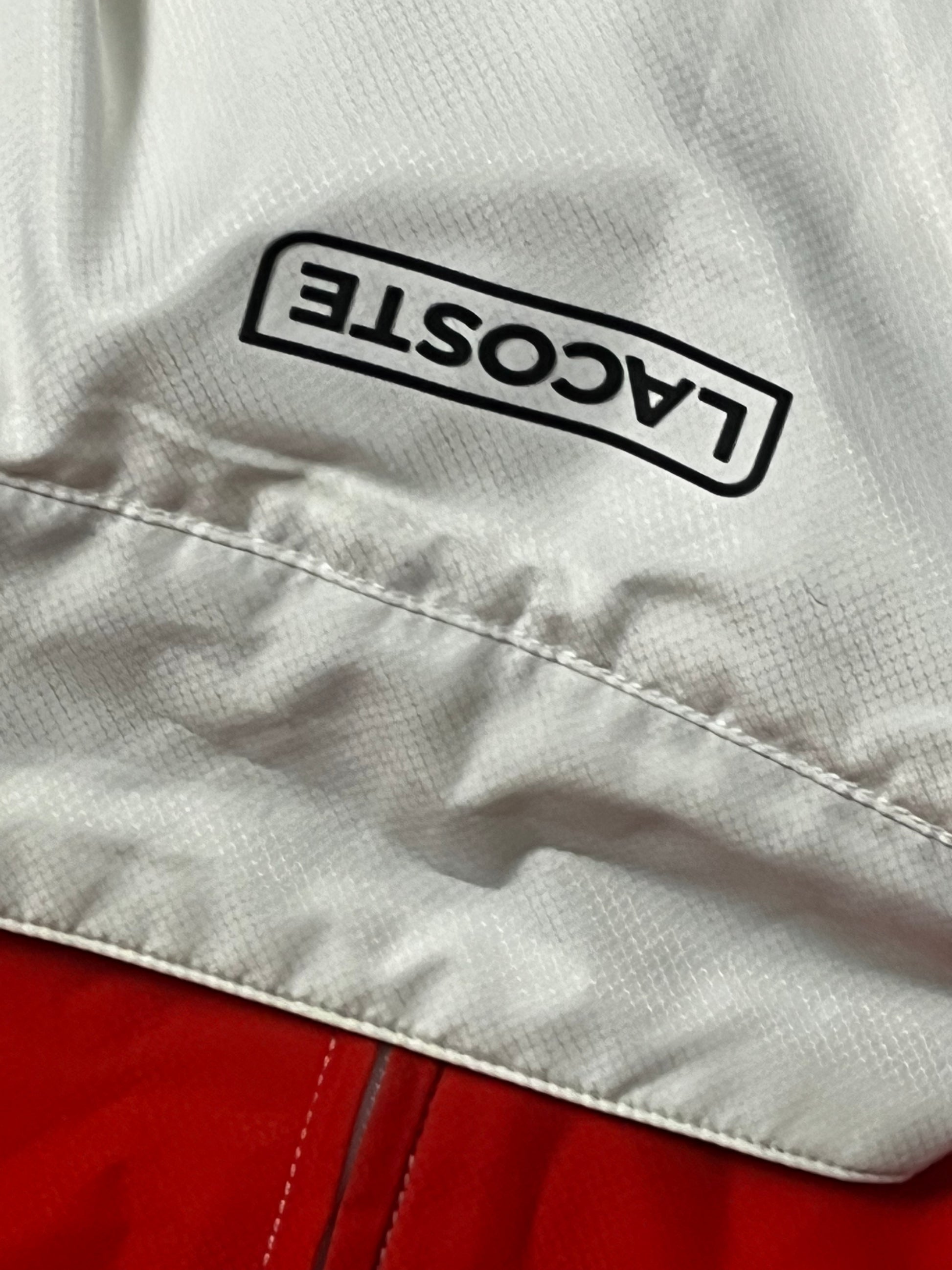 red/white Lacoste windbreaker {S}