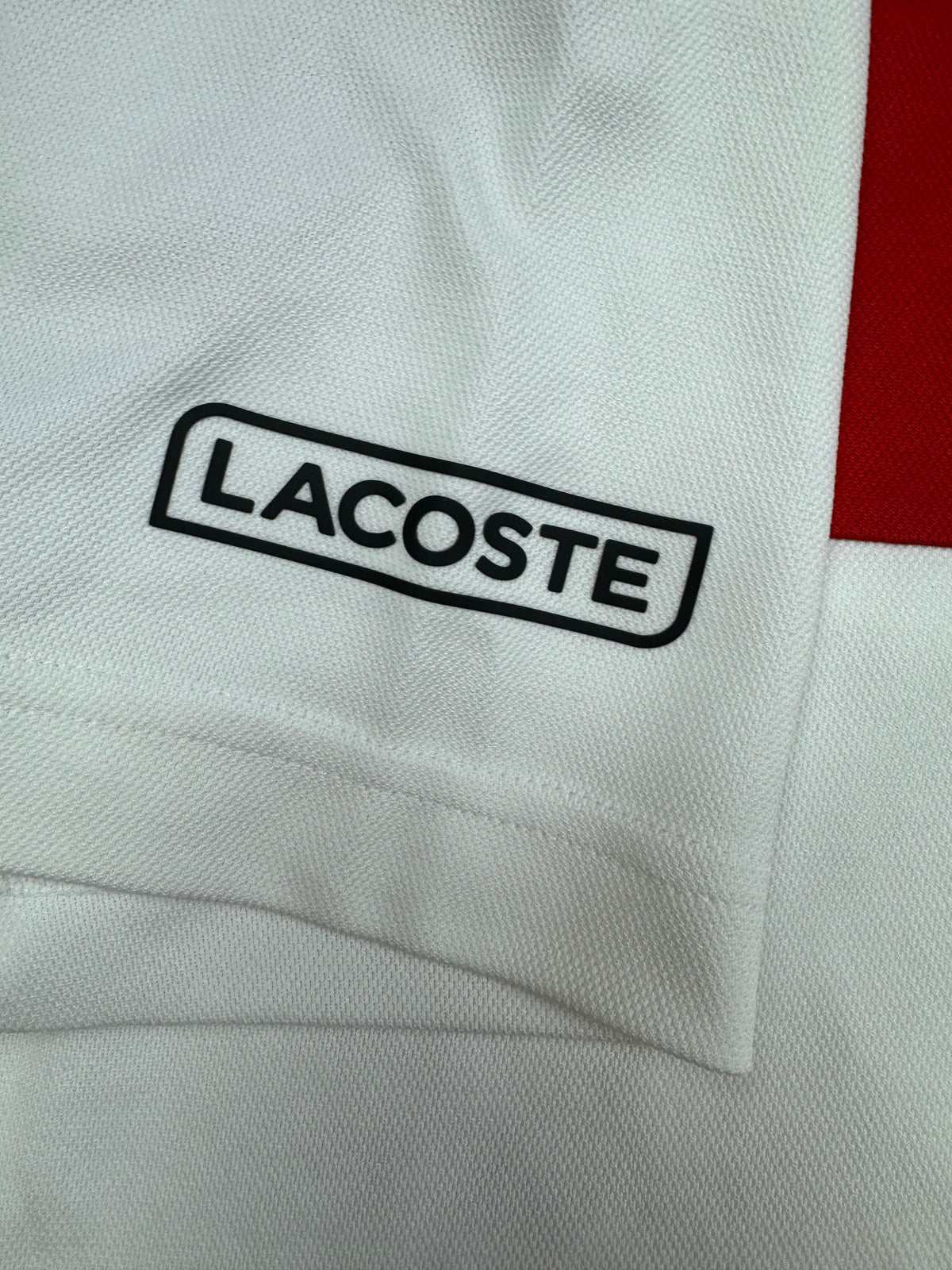 red Lacoste polo {XS}