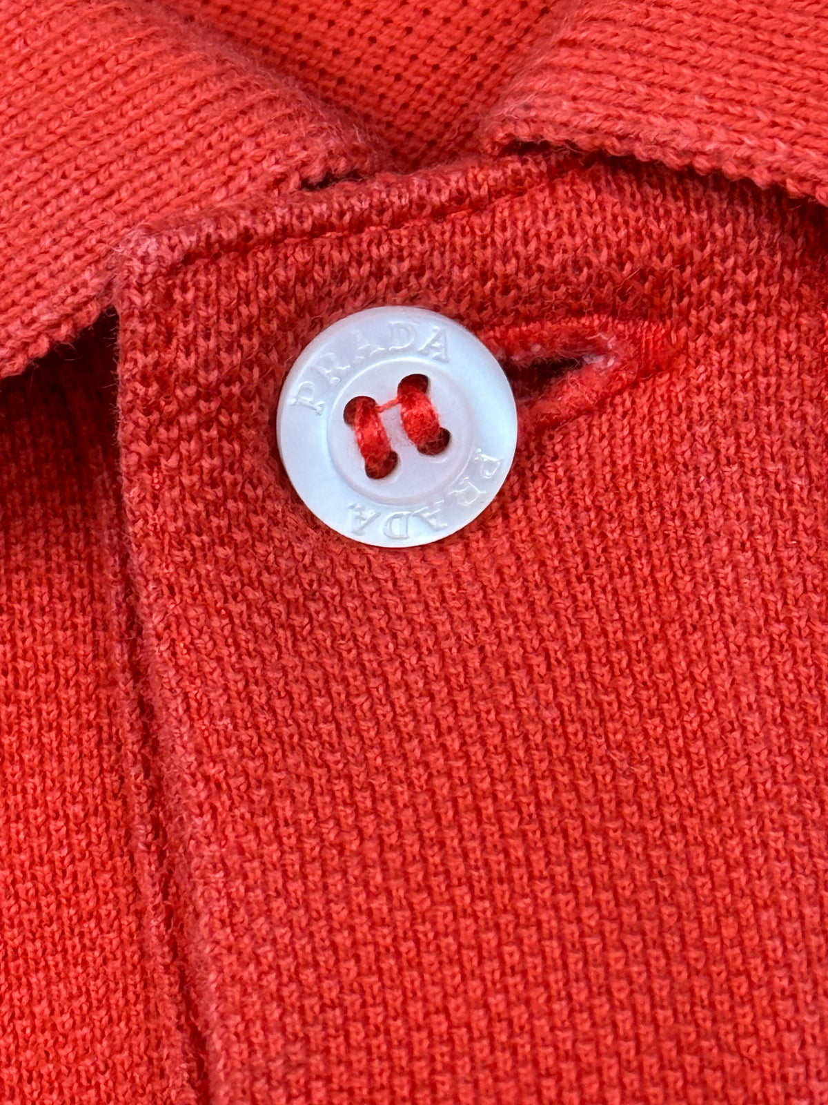 orange Prada polo {M}