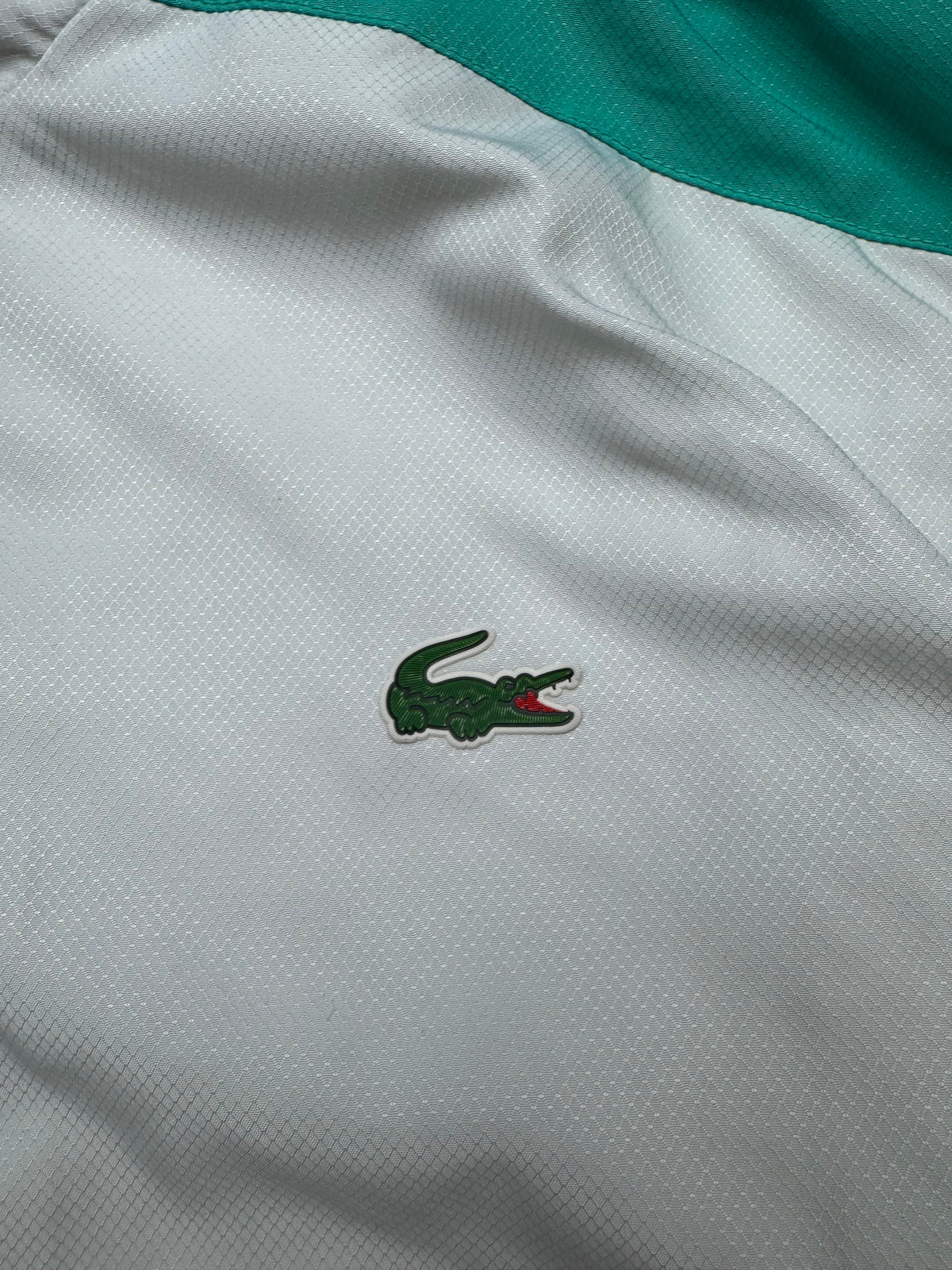 white Lacoste windbreaker {L}